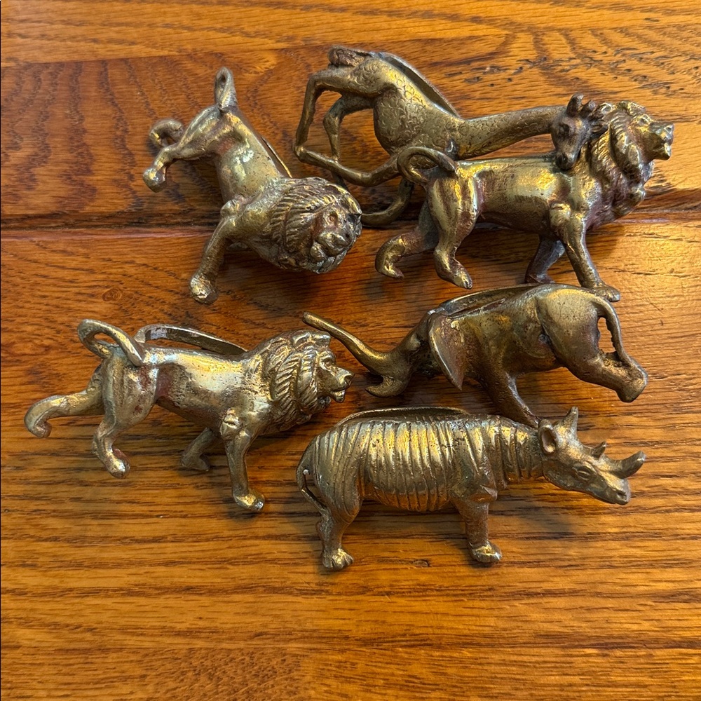 Six brass animal napkin rings holders. Made in India. Rhino, elephant, lion etc